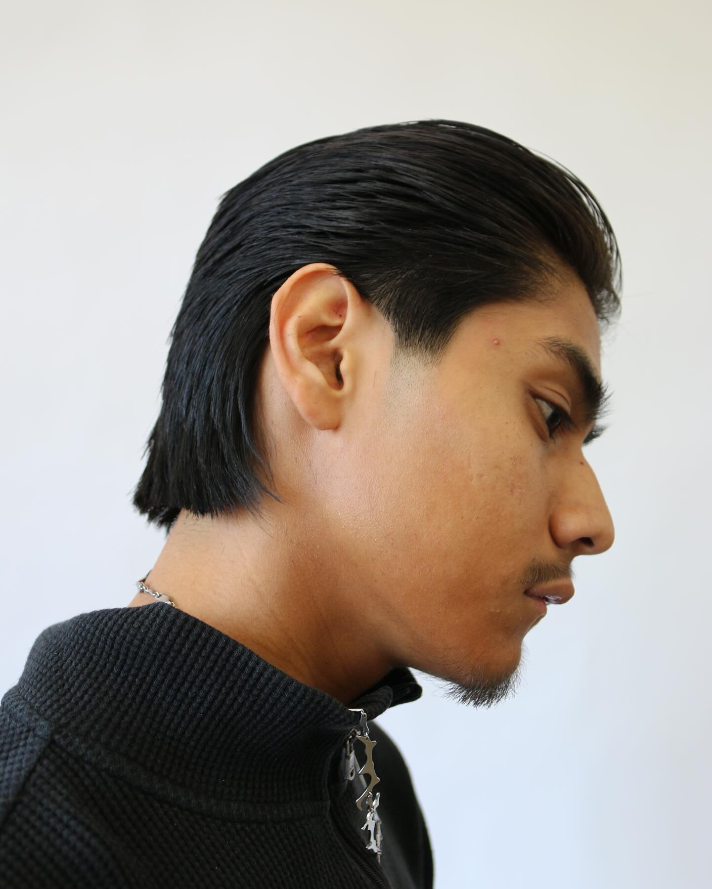 Long slicked-back shearwork cut by Aldo