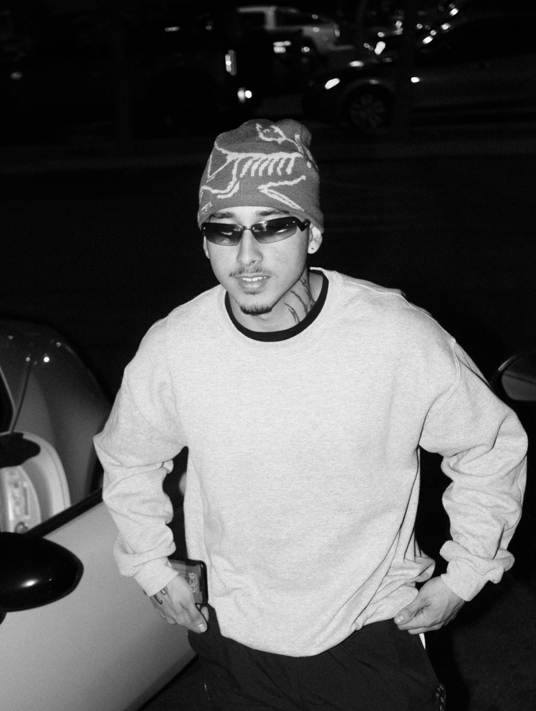 Aldo in a beanie and sunglasses, black-and-white street photo