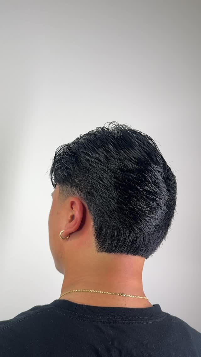 Brush back haircut with low taper by Lucas